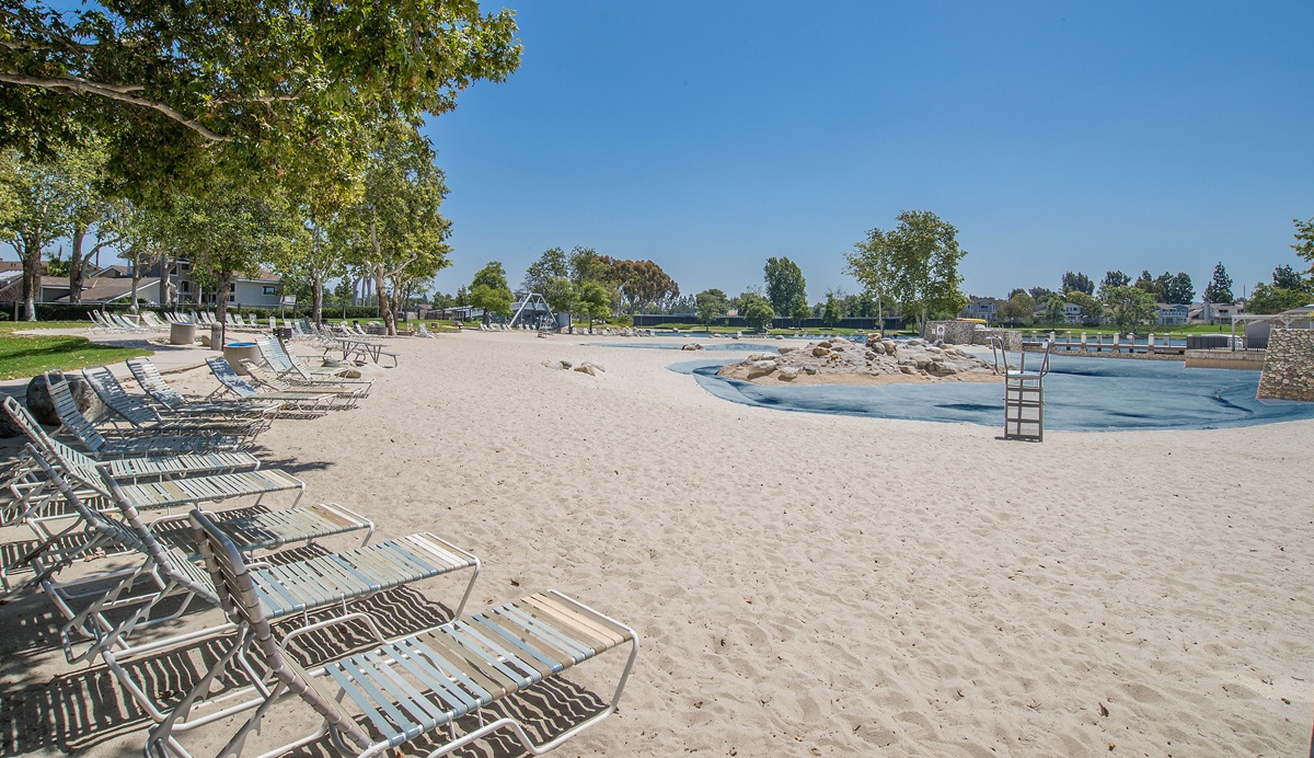 Beach club and lagoon area in Woodbridge Irvine with sandy beach and recreational amenities